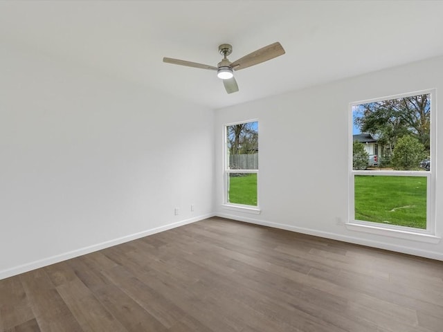 unfurnished room with ceiling fan and wood-type flooring