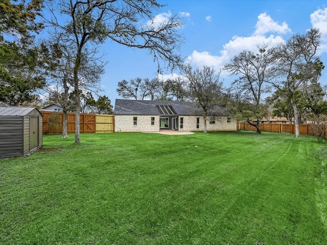 view of yard with a patio and a shed