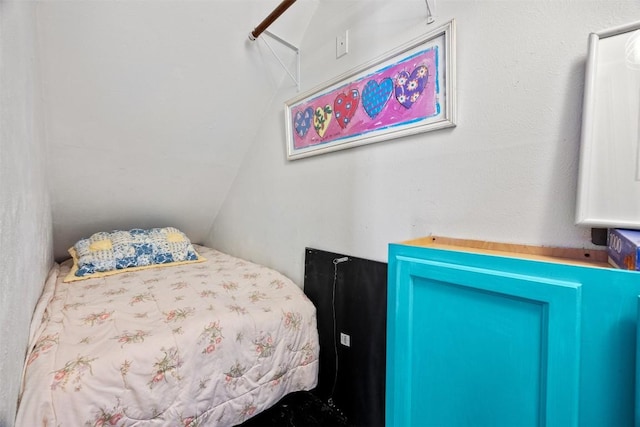 bedroom featuring lofted ceiling