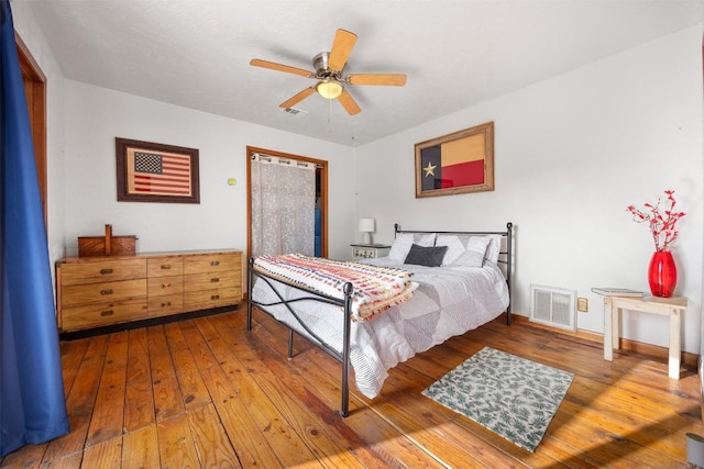 bedroom featuring ceiling fan and hardwood / wood-style flooring