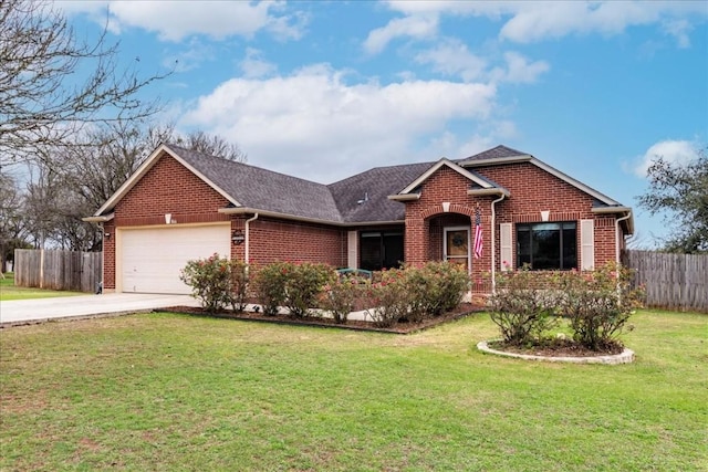 ranch-style home featuring brick siding, an attached garage, fence, driveway, and a front lawn