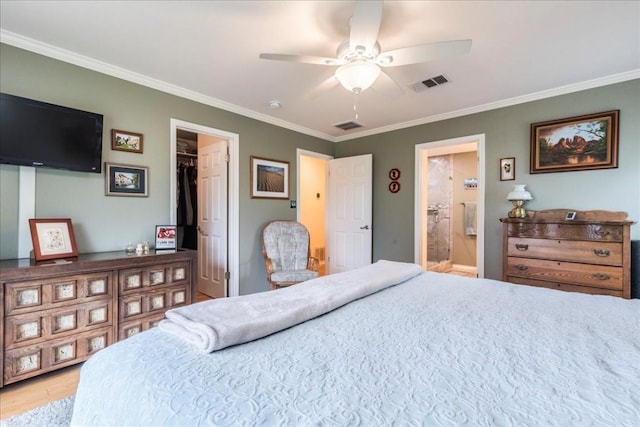 bedroom with ornamental molding, wood finished floors, and visible vents