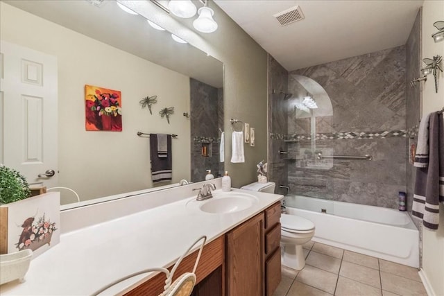 bathroom featuring visible vents, toilet, tile patterned floors, vanity, and shower / washtub combination