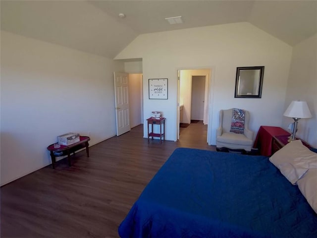 unfurnished bedroom featuring dark wood-type flooring and vaulted ceiling