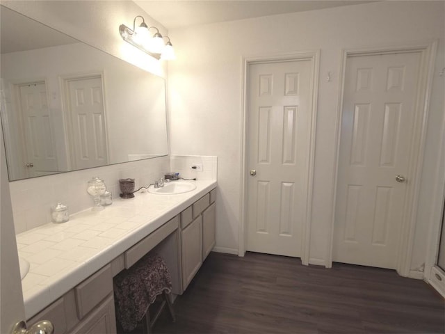 bathroom with wood-type flooring and vanity