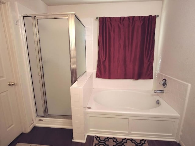 bathroom featuring plus walk in shower