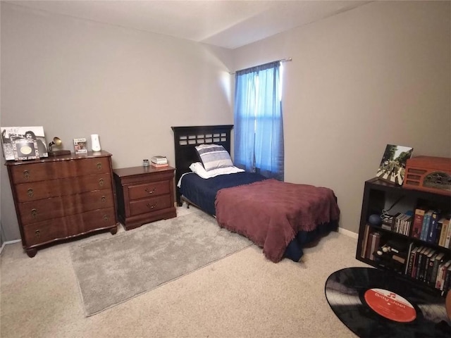 bedroom featuring light colored carpet