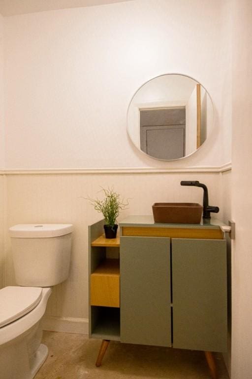 bathroom featuring sink and toilet