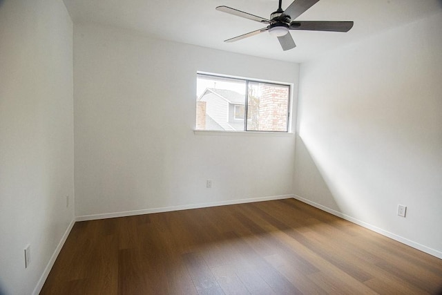 empty room with ceiling fan and hardwood / wood-style flooring