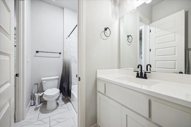 full bathroom with vanity, shower / tub combo, and toilet