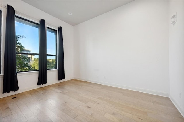 unfurnished room featuring light wood-type flooring