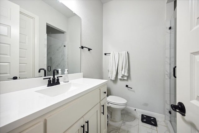 bathroom with vanity, toilet, and walk in shower