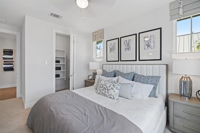 bedroom featuring ceiling fan and light colored carpet