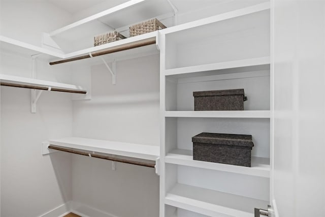 walk in closet featuring hardwood / wood-style flooring