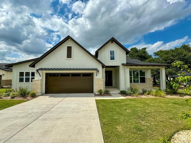 view of front facade featuring a garage and a front lawn