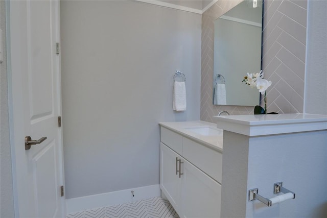 bathroom featuring tile patterned floors, vanity, and tasteful backsplash