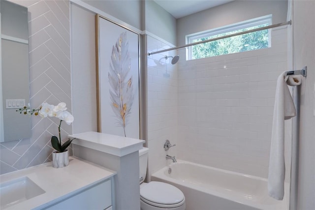 full bathroom featuring decorative backsplash, vanity, toilet, and tiled shower / bath