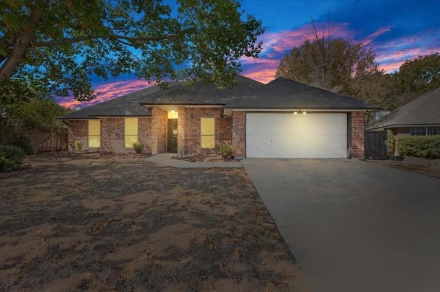 single story home featuring a garage