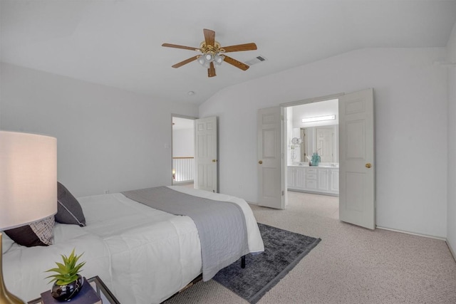 carpeted bedroom with connected bathroom, ceiling fan, and lofted ceiling