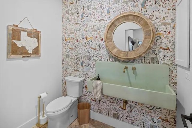 bathroom featuring sink and toilet