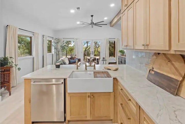 kitchen with sink, kitchen peninsula, dishwasher, and light brown cabinets