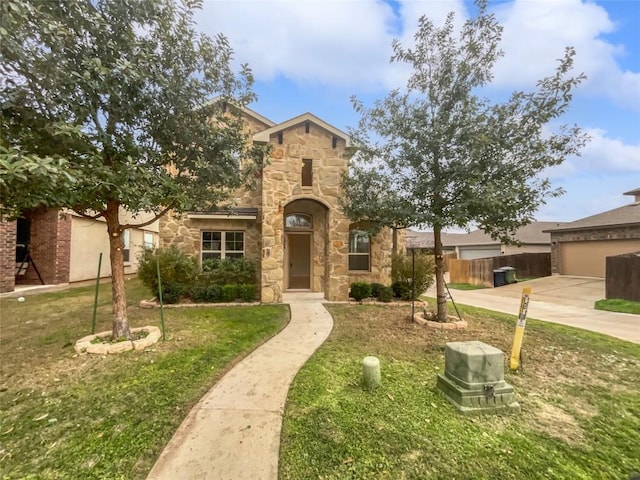 view of front facade with a front yard and a garage