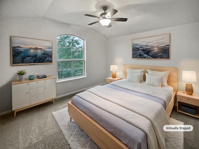 carpeted bedroom with ceiling fan and lofted ceiling