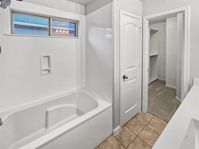 bathroom featuring  shower combination and tile patterned floors