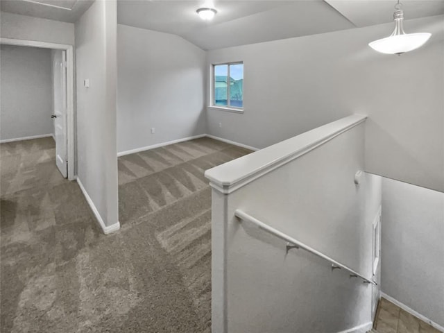 stairs with carpet flooring and lofted ceiling