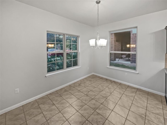 unfurnished dining area with light tile patterned flooring and an inviting chandelier