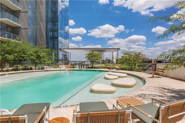 view of swimming pool featuring a pergola and a patio area