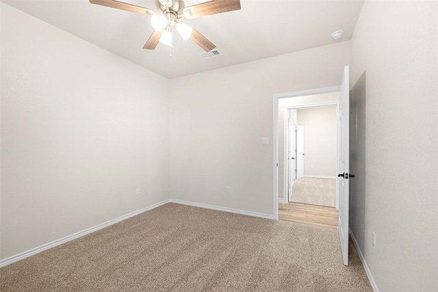 carpeted empty room with ceiling fan