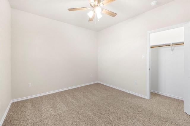 unfurnished bedroom featuring ceiling fan, a closet, and carpet