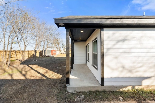 view of side of property with a patio