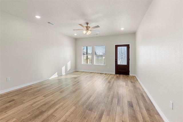 foyer featuring ceiling fan and light hardwood / wood-style floors