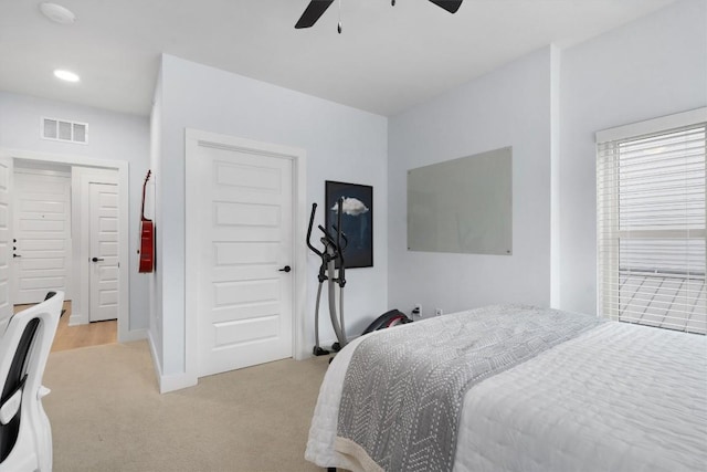 carpeted bedroom with ceiling fan