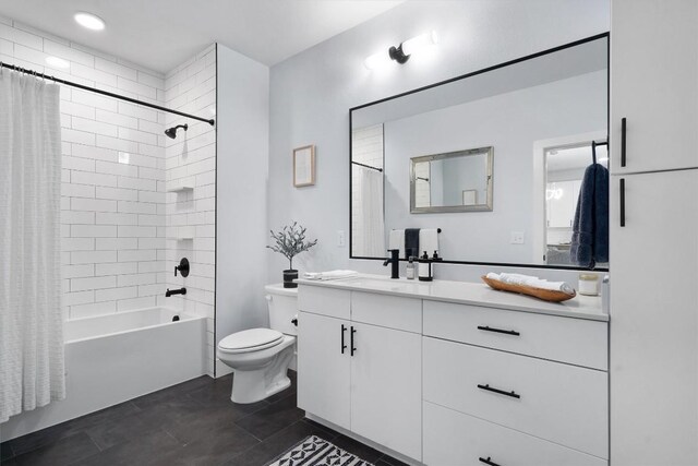 full bathroom with shower / tub combo, vanity, and toilet