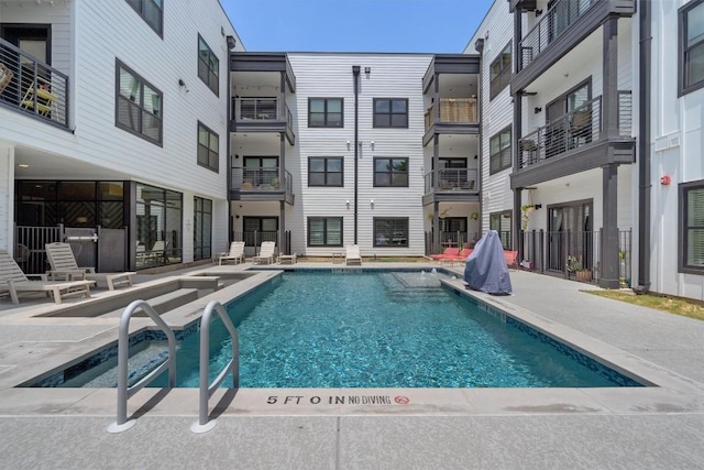 view of pool featuring a patio and pool water feature