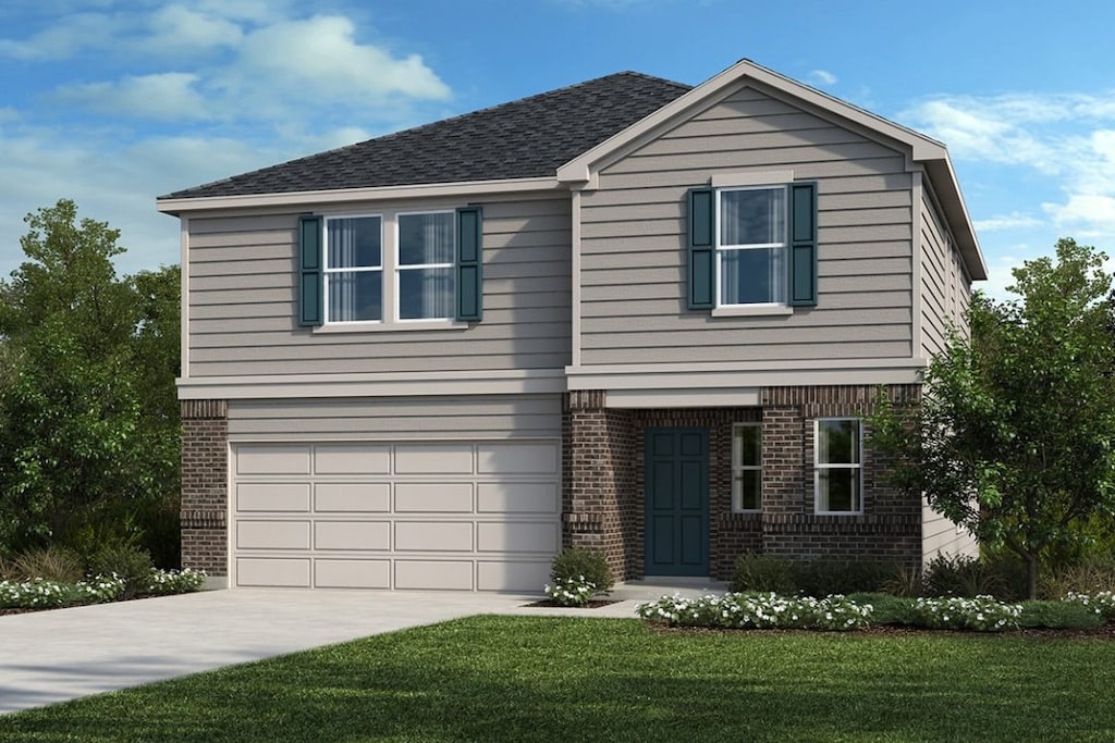 view of front facade with a garage and a front yard