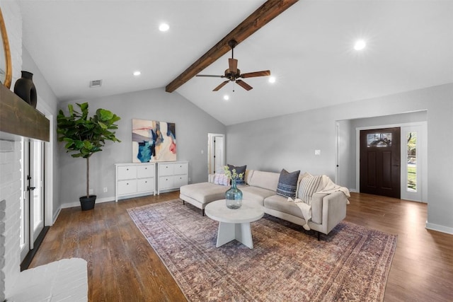 living room featuring lofted ceiling with beams, french doors, ceiling fan, and dark wood-type flooring