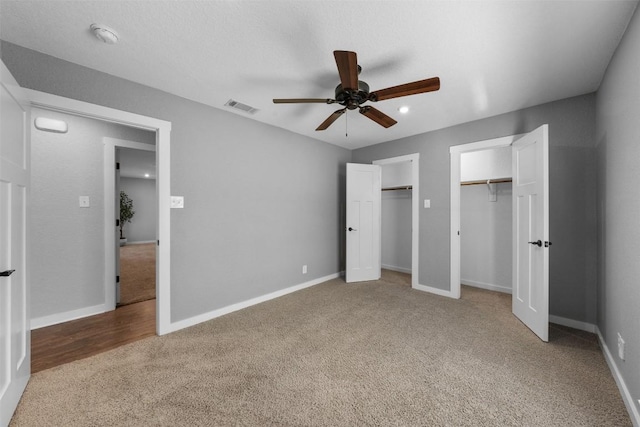 unfurnished bedroom with carpet flooring and ceiling fan