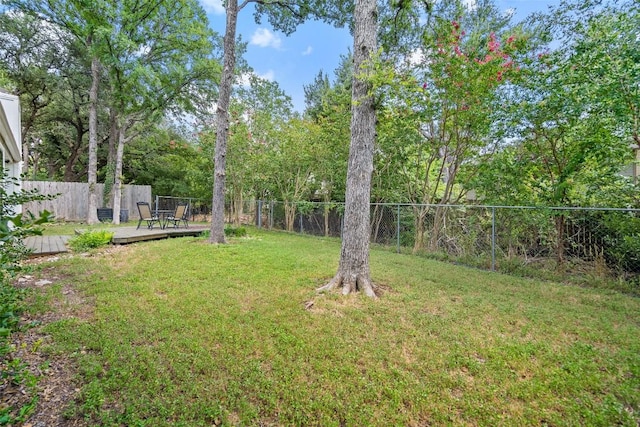 view of yard with a wooden deck