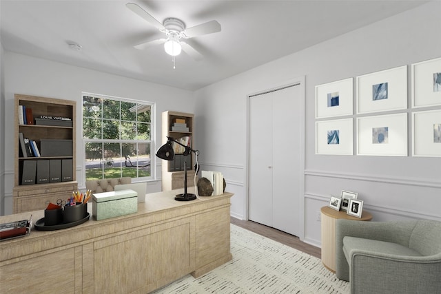 office space with ceiling fan and light hardwood / wood-style floors