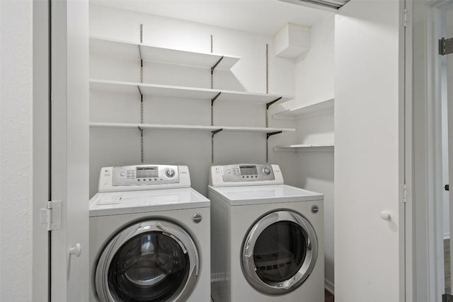 laundry area featuring washing machine and clothes dryer