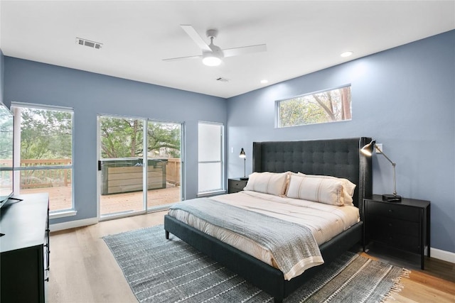 210 Finn St, Austin, TX 78734 - bedroom featuring access to exterior, wood finished floors, baseboards, a ceiling fan, and recessed lighting