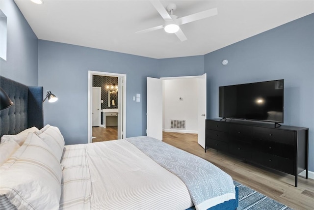 210 Finn St, Austin, TX 78734 - bedroom featuring wood finished floors, baseboards, and a ceiling fan