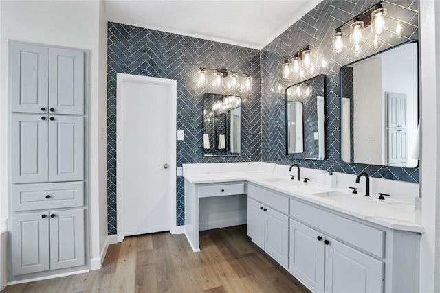 210 Finn St, Austin, TX 78734 - full bath featuring double vanity, tile walls, wood finished floors, and backsplash