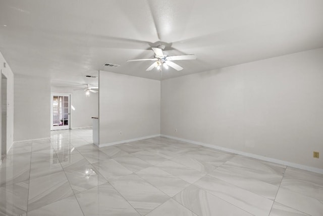 unfurnished room with ceiling fan