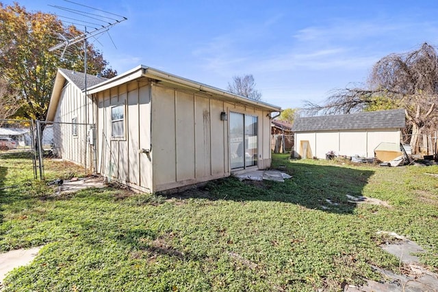 view of outbuilding with a lawn