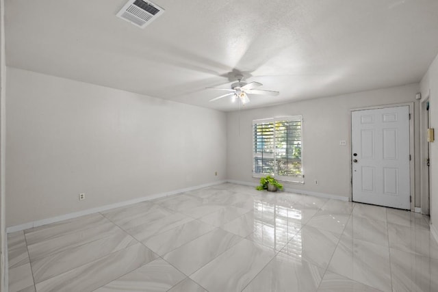 unfurnished room featuring ceiling fan